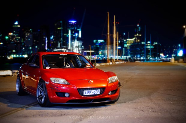 By the water, city Melbourne's skyline in the background.